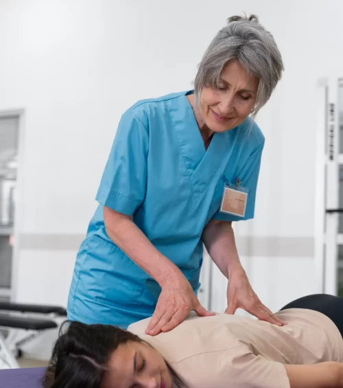 medical-assistant-helping-patient-with-physiotherapy-exercises.webp medical-assistant-helping-patient-with-physiotherapy-exercises.webp